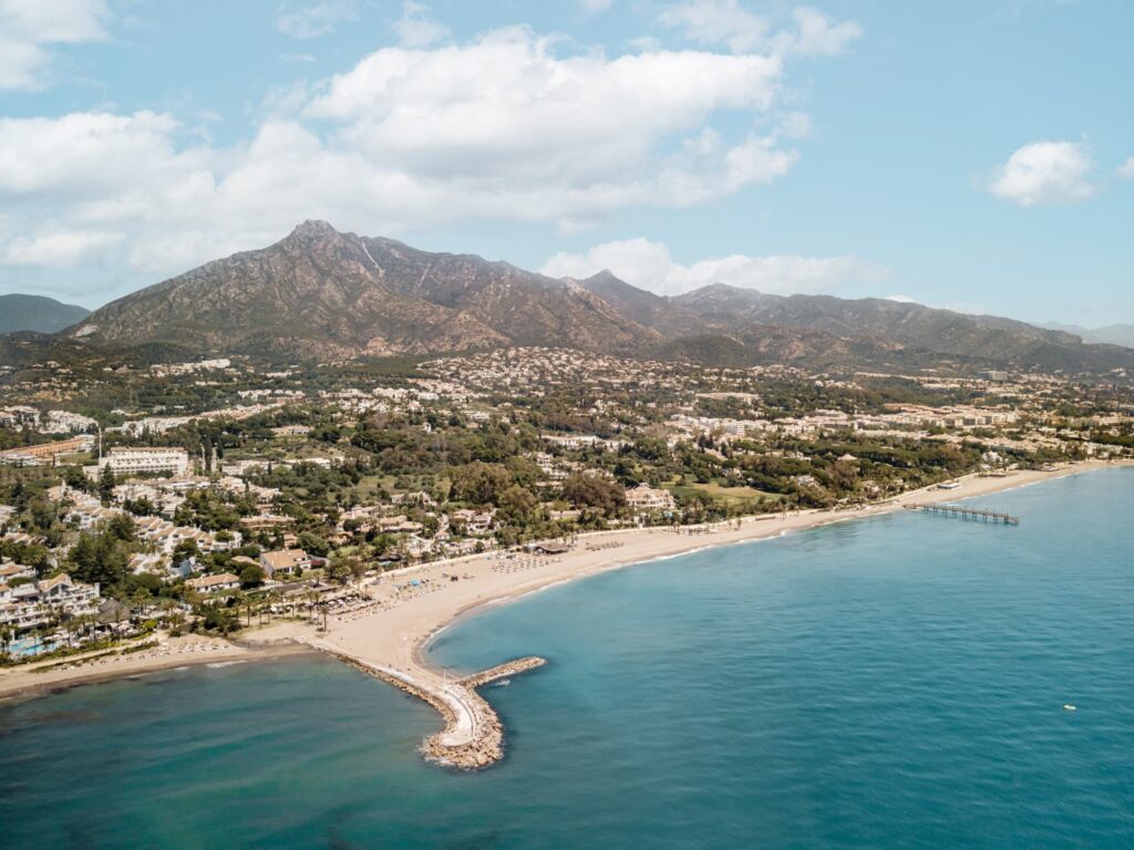 Top Neighborhoods in Marbella for International Buyers.
Puerto Banús Marina: Aerial view of Puerto Banús marina with luxury yachts.
Sierra Blanca Villa: A luxurious villa with a private pool in Sierra Blanca.
The Golden Mile Beachfront: Beachfront mansions along Marbella's Golden Mile.
Nueva Andalucía Golf Course: Scenic view of a golf course in Nueva Andalucía.
Los Monteros Beach: Tranquil beachfront property in Los Monteros.