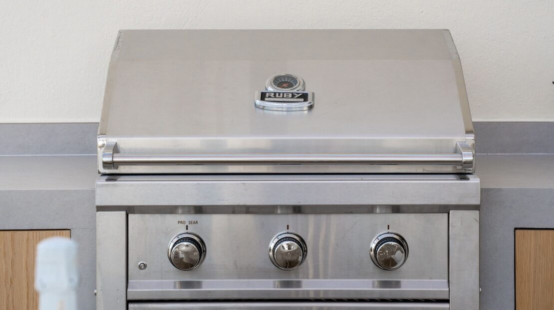 Close-up of Ruby luxury grill with stainless steel finish on Los Belvederes penthouse rooftop, Marbella outdoor kitchen