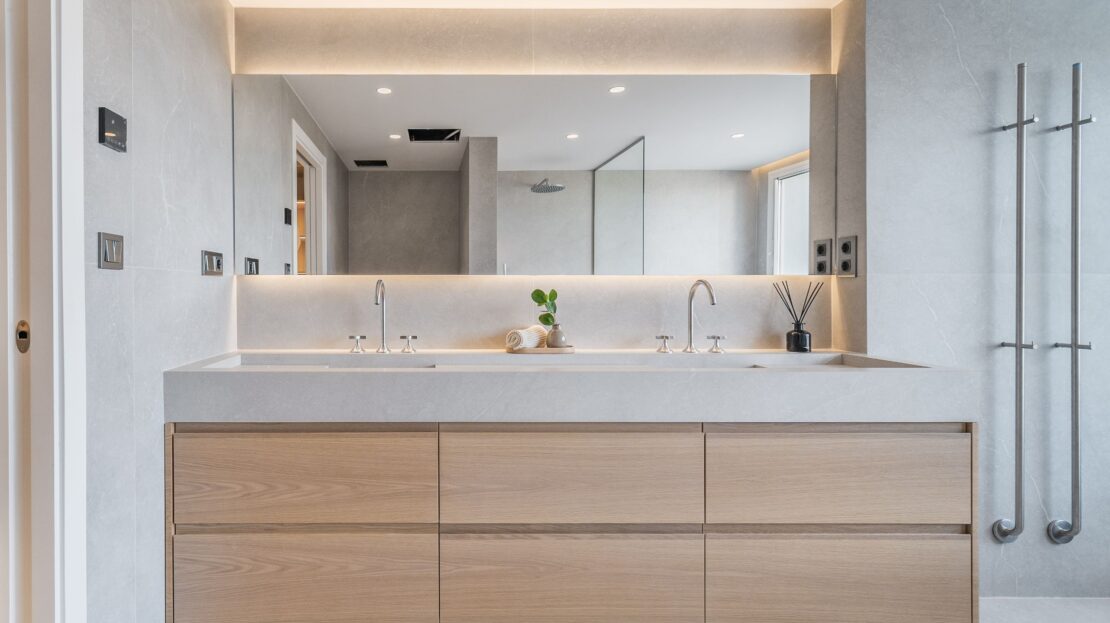 Luxury bathroom in Los Belvederes duplex penthouse featuring open rain shower, dual vanity sinks, and premium finishes, Marbella
