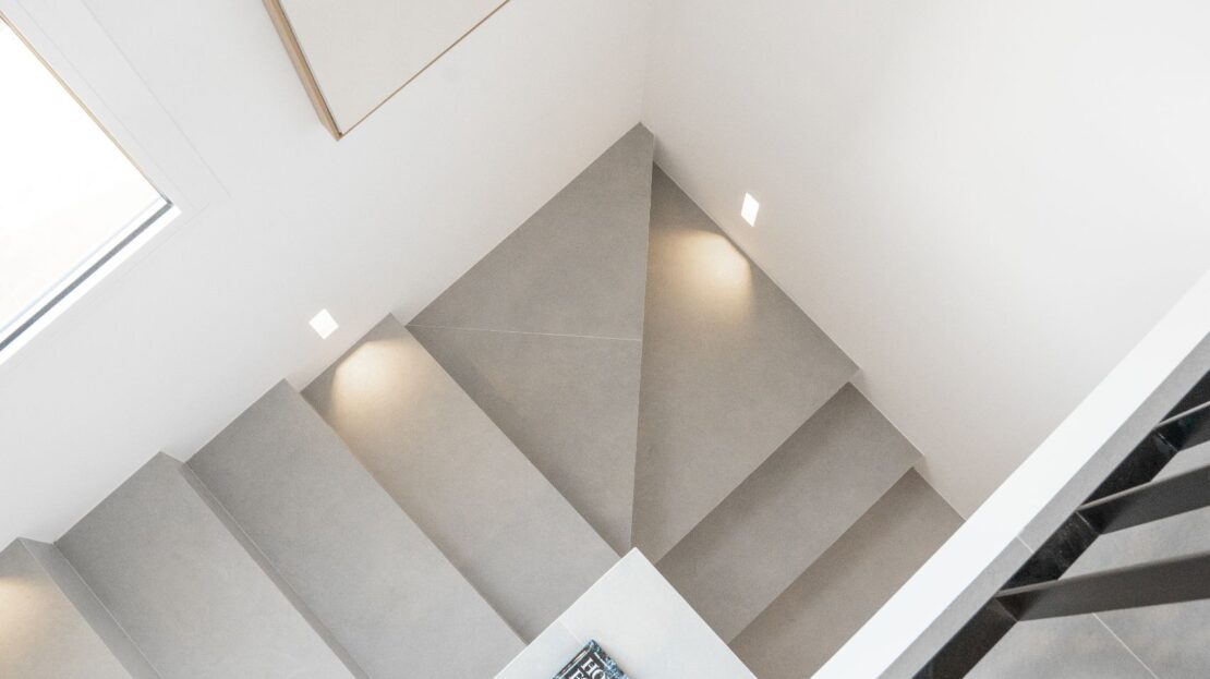 Aerial view of a sleek grey staircase with contemporary design in a luxury duplex penthouse, Los Belvederes, Nueva Andalucía, Marbella